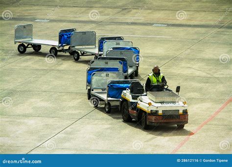 A baggage carrier at an airport .